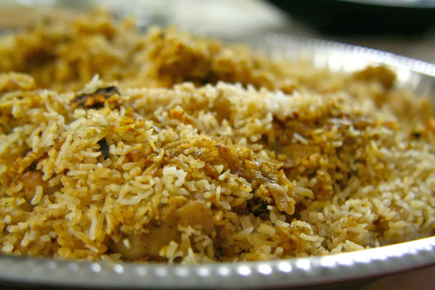 A close view of Malabar biryani with spiced rice and meat